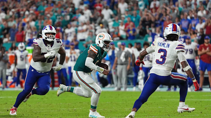 Miami Dolphins quarterback Tua Tagovailoa (1) scrambles with the ball against the Buffalo Bills during the second half at Hard Rock Stadium.