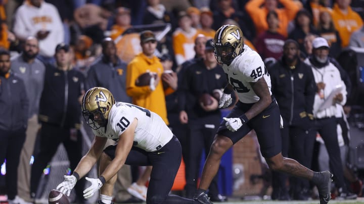 Nov 25, 2023; Knoxville, Tennessee, USA; Vanderbilt Commodores linebacker Langston Patterson (10) recovers a fumble against the Tennessee Volunteers during the second half at Neyland Stadium. Mandatory Credit: Randy Sartin-USA TODAY Sports