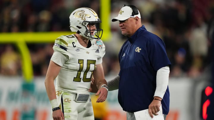 Dec 22, 2023; Tampa, FL, USA; Georgia Tech Yellow Jackets quarterback Haynes King (10) talks with head coach Brent Key during the second half of the Gasparilla Bowl against the UCF Knights at Raymond James Stadium. Mandatory Credit: Jasen Vinlove-USA TODAY Sports