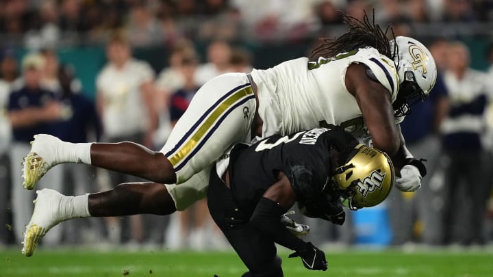 Dec 22, 2023; Tampa, FL, USA; Georgia Tech Yellow Jackets defensive lineman Zeek Biggers (88) tackles UCF Knights wide receiver Xavier Townsend (3) during the first half of the Gasparilla Bowl at Raymond James Stadium. Mandatory Credit: Jasen Vinlove-USA TODAY Sports