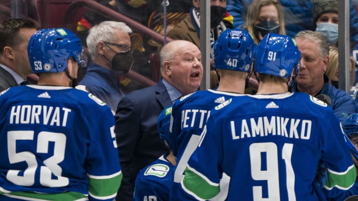 Feb 21, 2022; Vancouver, British Columbia, CAN; Vancouver Canucks head coach Bruce Boudreau gives instructions from the bench against the Seattle Kraken in the third period at Rogers Arena. Canucks won 5-2. Mandatory Credit: Bob Frid-USA TODAY Sports