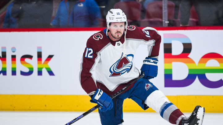 Jan 15, 2024; Montreal, Quebec, CAN; Colorado Avalanche center Ryan Johansen (12) stretches on the ice during warm-up before the game against the Montreal Canadiens at Bell Centre. Mandatory Credit: David Kirouac-USA TODAY Sports