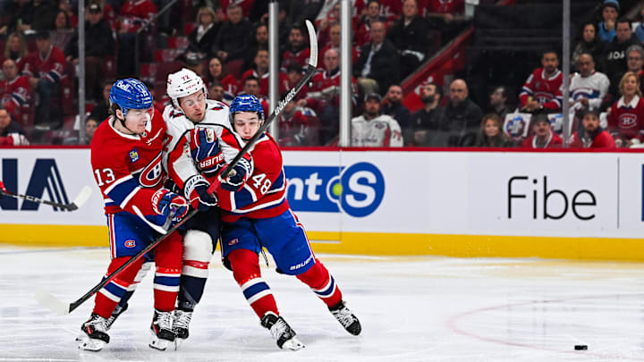 Apr 27, 2025; Montreal, Quebec, CAN; Montreal Canadiens right wing Cole Caufield (13) and defenseman Lane Hutson (48)defend against Washington Capitals left wing Anthony Beauvillier (72) during the second period in game four of the first round of the 2025 Stanley Cup Playoffs at Bell Centre. Mandatory Credit: David Kirouac-Imagn Images