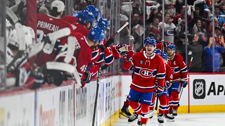 Apr 27, 2025; Montreal, Quebec, CAN; Montreal Canadiens right wing Cole Caufield (13) celebrates with his teammates at the bench his goal against the Washington Capitals during the second period in game four of the first round of the 2025 Stanley Cup Playoffs at Bell Centre. Mandatory Credit: David Kirouac-Imagn Images