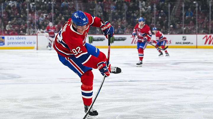 Mar 22, 2025; Montreal, Quebec, CAN; Montreal Canadiens right wing Patrik Laine (92) shoots the puck against the Colorado Avalanche in the first period at Bell Centre. Mandatory Credit: David Kirouac-Imagn Images