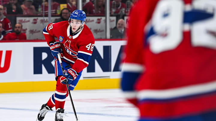 Apr 14, 2025; Montreal, Quebec, CAN; Montreal Canadiens defenseman Lane Hutson (48) plays the puck against the Chicago Blackhawks in the second period at Bell Centre. Mandatory Credit: David Kirouac-Imagn Images