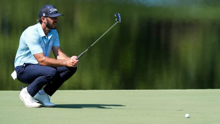 Max Homa sizes up a putt.