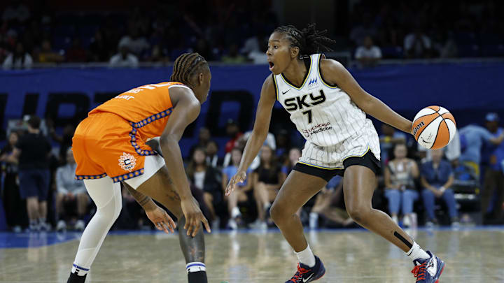 Aug 23, 2025; Chicago, Illinois, USA; Chicago Sky guard Ariel Atkins (7) drives to the basket against Connecticut Sun guard Saniya Rivers (22) during the second half at Wintrust Arena. Mandatory Credit: Kamil Krzaczynski-Imagn Images