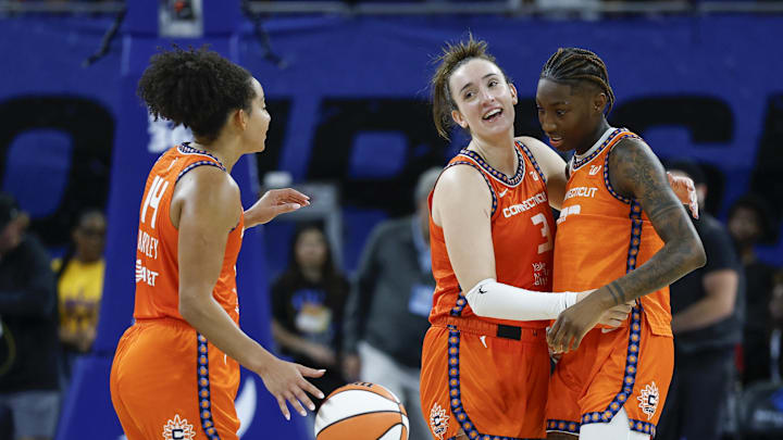 Aug 23, 2025; Chicago, Illinois, USA; Connecticut Sun guard Marina Mabrey (3) celebrates with guard Saniya Rivers (22) and guard Bria Hartley (14) teams win against the Chicago Sky in a WNBA game at Wintrust Arena. Kamil Krzaczynski-Imagn Images