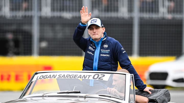 Jun 18, 2023; Montreal, Quebec, CAN; Williams driver Logan Sargeant (USA) parades and salutes the crowd before the Canadian Grand Prix at Circuit Gilles Villeneuve. Mandatory Credit: David Kirouac-USA TODAY Sports