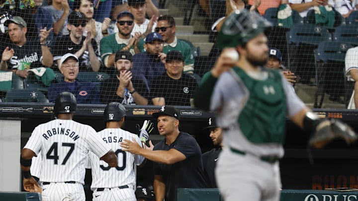 Sep 14, 2024; Chicago, Illinois, USA; Chicago White Sox interim manager Grady Sizemore (24) congratulates third baseman Lenyn Sosa (50) and catcher Chuckie Robinson (47) after they scored against the Oakland Athletics during the second inning at Guaranteed Rate Field.