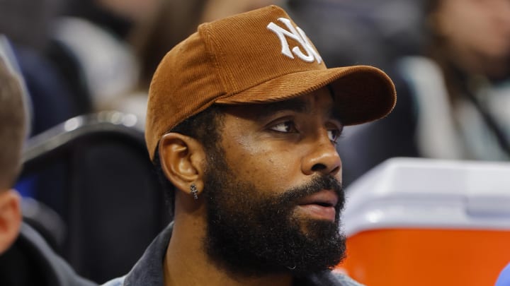 Dec 28, 2023; Minneapolis, Minnesota, USA; Dallas Mavericks guard Kyrie Irving (11) watches as his team plays the Minnesota Timberwolves in the second quarter at Target Center. Mandatory Credit: Bruce Kluckhohn-USA TODAY Sports