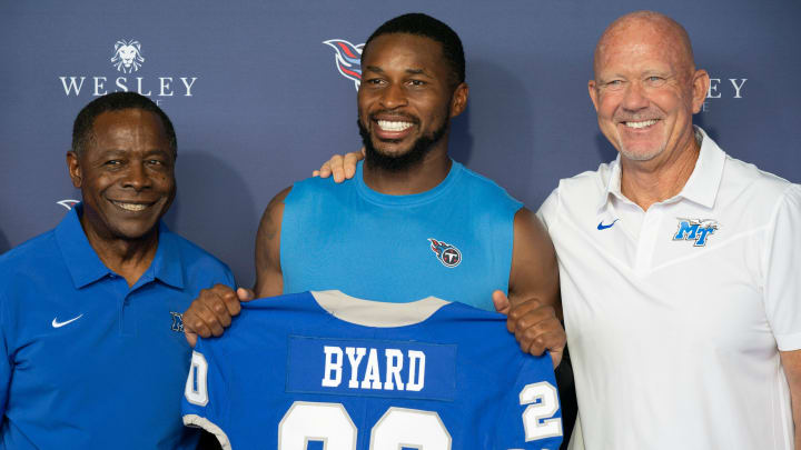 Middle Tennessee State University president Sidney McPhee (lt) and head football coach Rick Stockstill (rt) pose with with Tennessee Titans free safety Kevin Byard after announcing announce the  retirement of Byard's college number at MTSU following a Titans practice at Ascension Saint Thomas Sports Park Thursday, Aug. 4, 2022, in Nashville, Tenn.

Nas 0804 Titans Byard 008