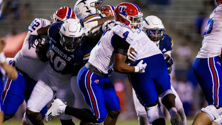 UTEP Miners linebacker Tyrice Knight (10) and company try to tackle Louisiana Tech Bulldogs running back Tyre Shelton (4) during the first half at Sun Bowl Stadium in El Paso, Texas, Friday, September 29, 2023.