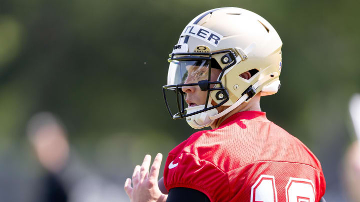 May 11, 2024; New Orleans, LA, USA;  New Orleans Saints quarterback Spencer Rattler (18) runs quarterback drills during the rookie minicamp at the Ochsner Sports Performance Center. Mandatory Credit: Stephen Lew-USA TODAY Sports