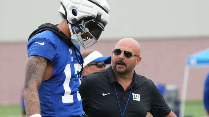 East Rutherford, NJ -- July 24, 2024 -- Wide receiver Jalin Hyatt and head coach Brian Daboll during the first day of training camp for the 2024 New York Giants.