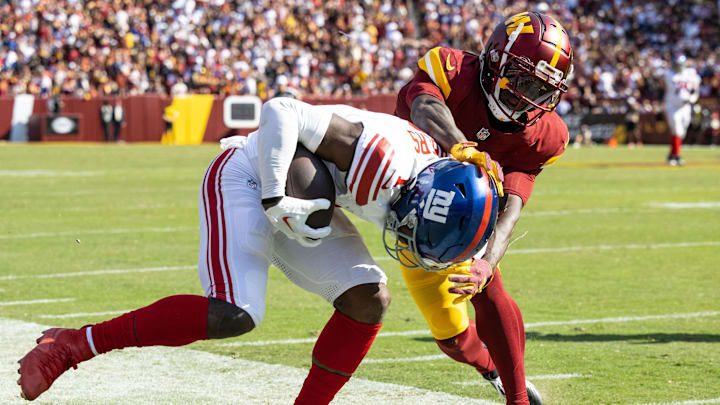 Sep 15, 2024; Landover, Maryland, USA; Washington Commanders cornerback Benjamin St-Juste (25) forces New York Giants wide receiver Malik Nabers (1) out of bounds during the second half at Commanders Field.  