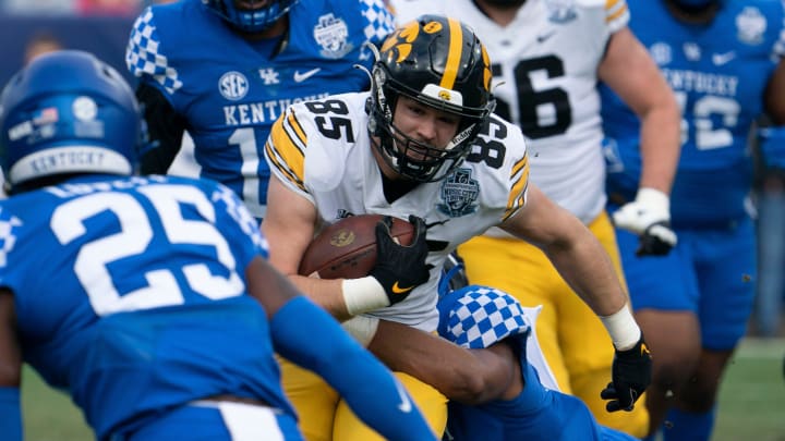 Iowa tight end Luke Lachey (85) gains a first down past Kentucky defense during the first quarter of the TransPerfect Music City Bowl, Saturday, Dec. 31, 2022, at Nissan Stadium in Nashville, Tenn.

Syndication The Tennessean