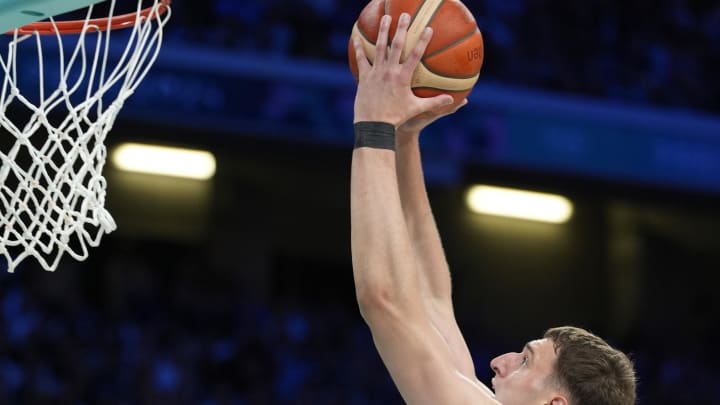 Aug 3, 2024; Villeneuve-d'Ascq, France; Serbia power forward Nikola Jovic (5) dunks in the third quarter against South Sudan during the Paris 2024 Olympic Summer Games at Stade Pierre-Mauroy. Mandatory Credit: John David Mercer-USA TODAY Sports