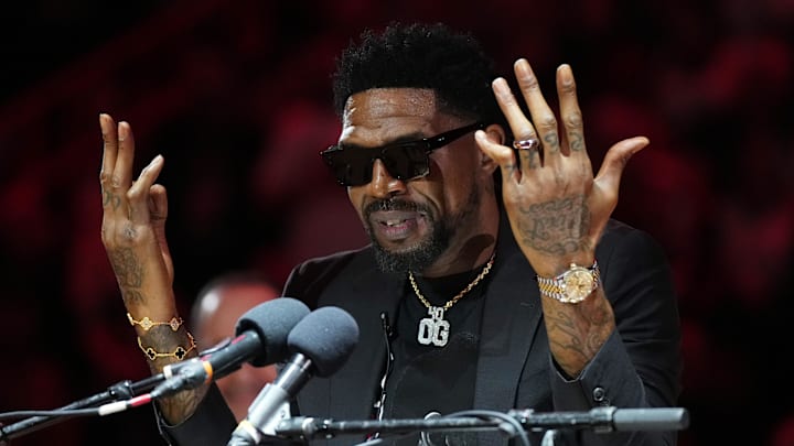 Jan 19, 2024; Miami, Florida, USA; Udonis Haslem speaks after his jersey was lifted to the rafters during the retirement ceremony during halftime of the game between the Miami Heat and the Atlanta Hawks Kaseya Center. Mandatory Credit: Jasen Vinlove-Imagn Images
