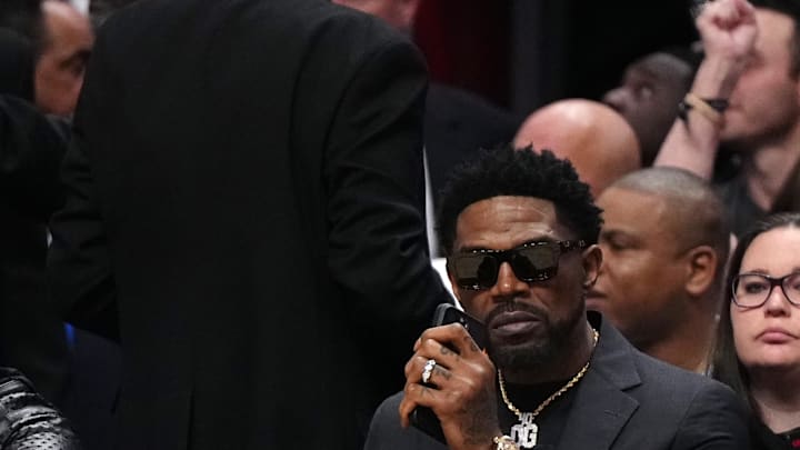 Jan 19, 2024; Miami, Florida, USA; Former Miami Heat player Udonis Haslem sits court-side during the first half between the Miami Heat and the Atlanta Hawks at Kaseya Center. Mandatory Credit: Jasen Vinlove-Imagn Images