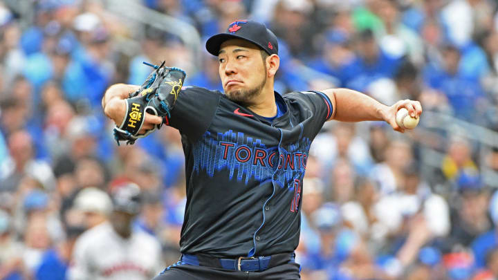 Jul 3, 2024; Toronto, Ontario, CAN; Toronto Blue Jays starting pitcher Yusei Kikuchi (16) pitches in the first inning against the Houston Astros at Rogers Centre. Mandatory Credit: Gerry Angus-USA TODAY Sports