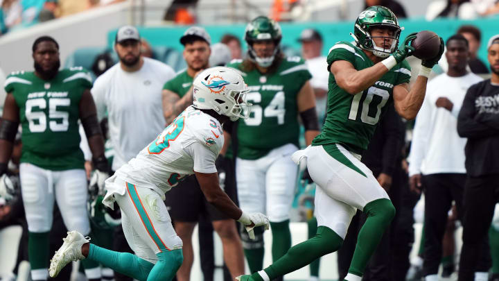 Dec 17, 2023; Miami Gardens, Florida, USA; New York Jets wide receiver Allen Lazard (10) makes a catch in front of Miami Dolphins cornerback Eli Apple (33) during the second half at Hard Rock Stadium. 