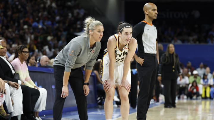 Indiana Fever head coach Christie Sides talks with guard Caitlin Clark (22) during the second half of a basketball game against the Chicago Sky at Wintrust Arena.