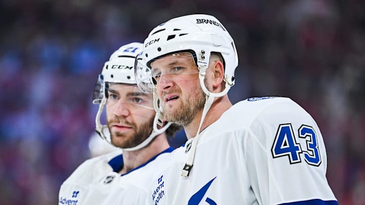 Apr 26, 2026; Montreal, Quebec, CAN; Tampa Bay Lightning defenseman Darren Raddysh (43) looks on beside center Brayden Point (21) during warm-up before the game against the Montreal Canadiens in game four of the first round of the 2026 Stanley Cup Playoffs at Bell Centre. Mandatory Credit: David Kirouac-Imagn Images