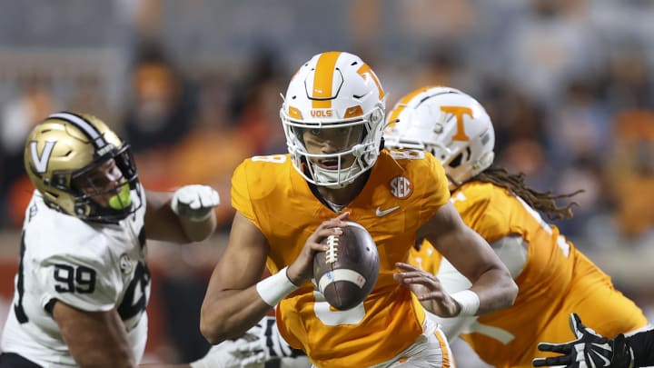 Nov 25, 2023; Knoxville, Tennessee, USA; Tennessee Volunteers quarterback Nico Iamaleava (8) scrambles with the ball against the Vanderbilt Commodores during the second half at Neyland Stadium. Mandatory Credit: Randy Sartin-USA TODAY Sports