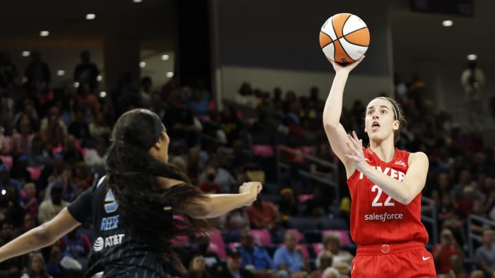 Aug 30, 2024; Chicago, Illinois, USA; Indiana Fever guard Caitlin Clark (22) shoots against Chicago Sky forward Angel Reese (5) during the first half at Wintrust Arena. Mandatory Credit: Kamil Krzaczynski-USA TODAY Sports