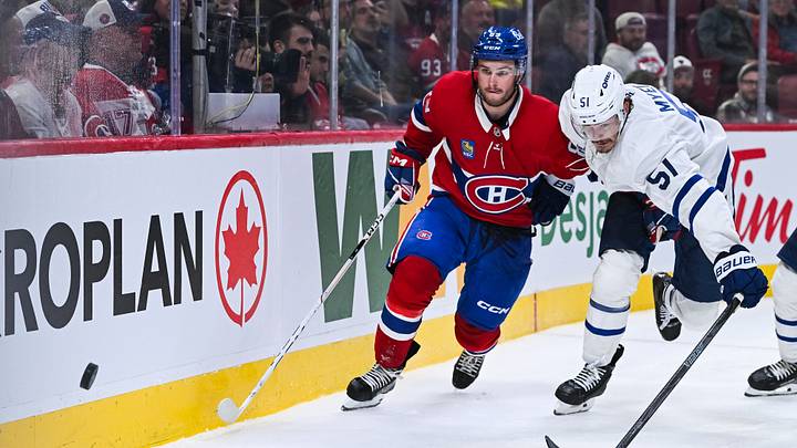 Montreal Canadiens right wing Joshua Roy and Toronto Maple Leafs defenseman Philippe Myers skate towards the puck during the third period at Bell Centre. Mandatory Credit: David Kirouac-Imagn Images