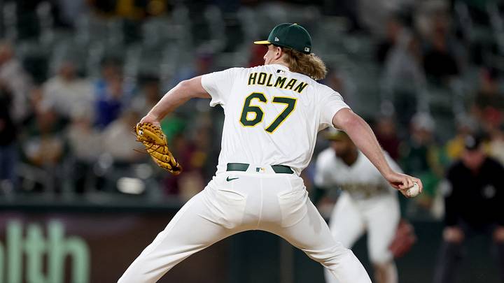 May 24, 2025; West Sacramento, California, USA; Athletics pitcher Grant Holman (67) throws a pitch against the Philadelphia Phillies during the tenth inning at Sutter Health Park. Mandatory Credit: Dennis Lee-Imagn Images