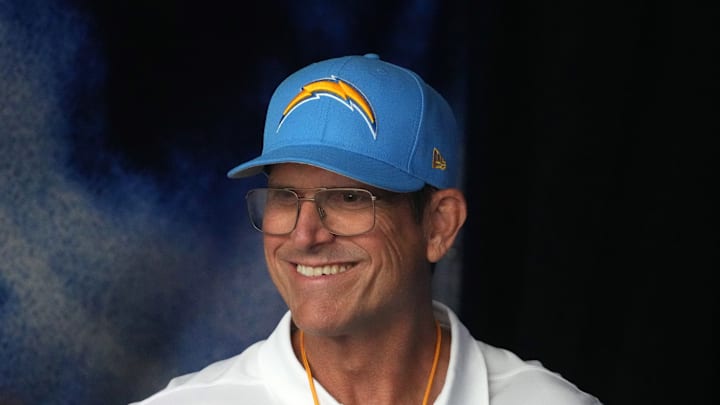 Aug 17, 2024; Inglewood, California, USA; Los Angeles Chargers coach Jim Harbaugh reacts against the Los Angeles Rams in the first half at SoFi Stadium.