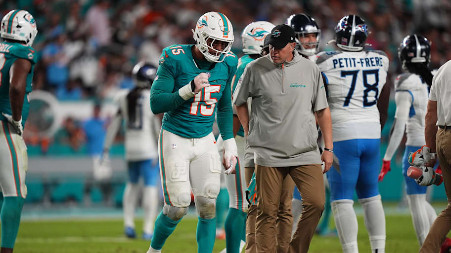 Sep 30, 2024; Miami Gardens, Florida, USA; Miami Dolphins linebacker Jaelan Phillips (15) walks off the field with a team trainer after an apparent injury during the second half against the Tennessee Titans at Hard Rock Stadium.  | Jasen Vinlove-Imagn Images