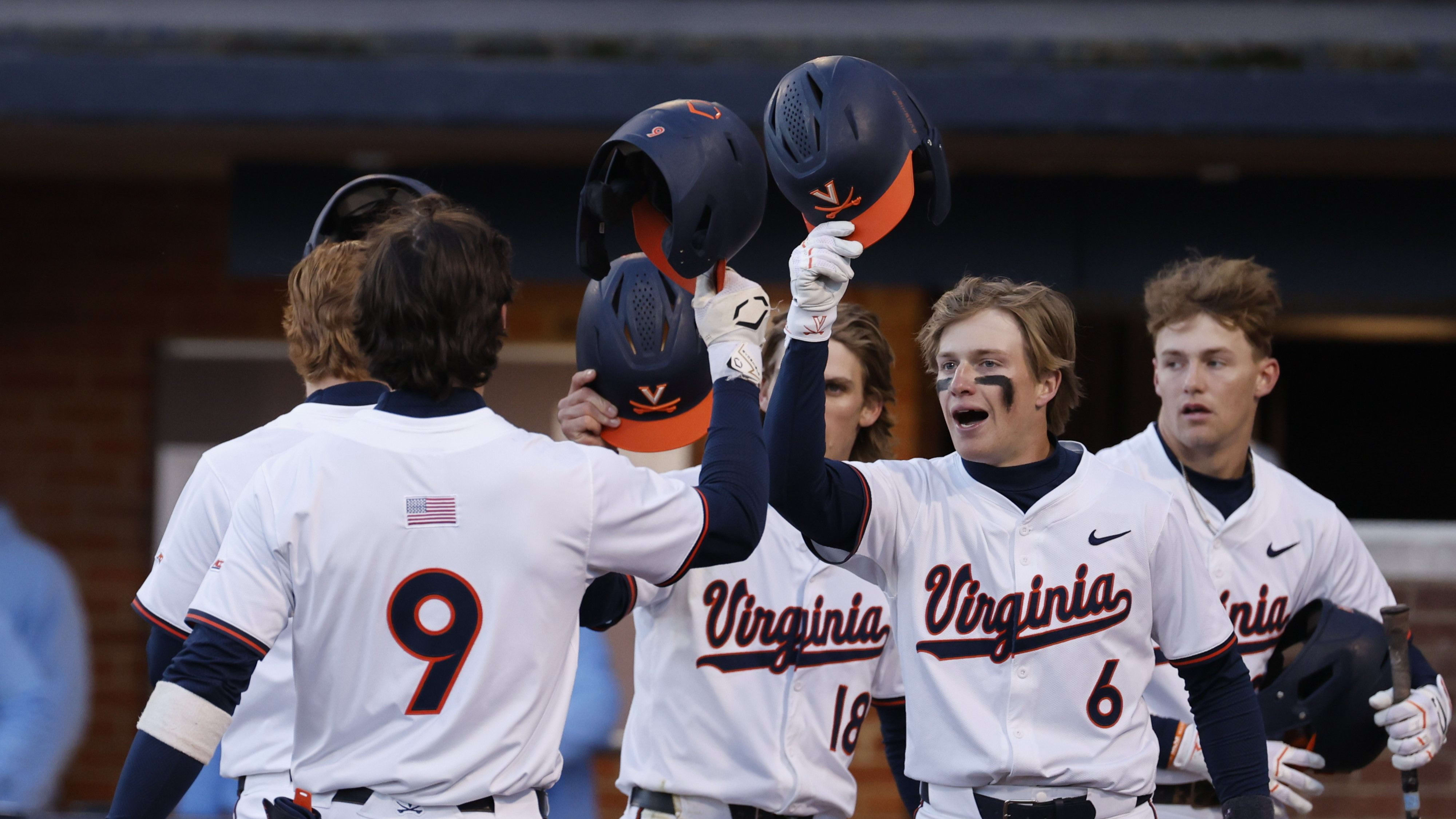 Henry Ford (9) celebrates with his teammates after hitting a grand slam during the Virginia baseball game vs. North Carolina.