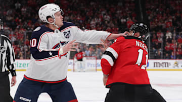 Columbus Blue Jackets left wing Dmitri Voronkov (10) and New Jersey Devils right wing Stefan Noesen (11) fight: Ed Mulholland-Imagn Images