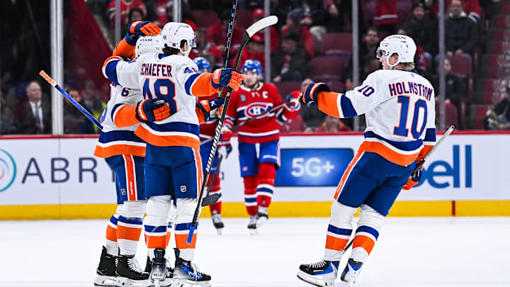 Feb 26, 2026; Montreal, Quebec, CAN; New York Islanders defenseman Matthew Schaefer (48) celebrates with right wing Simon Holmstrom (10) his second goal of the game against the Montreal Canadiens during the second period at Bell Centre. Mandatory Credit: David Kirouac-Imagn Images