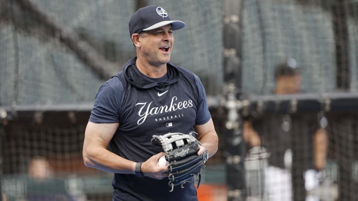 Aug 12, 2024; Chicago, Illinois, USA; New York Yankees manager Aaron Boone (17) warms up during batting practice before a game against the Chicago White Sox at Guaranteed Rate Field. Mandatory Credit: Kamil Krzaczynski-USA TODAY Sports