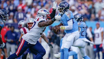 New England Patriots defensive end Milton Williams (97) sacks Tennessee Titans quarterback Cam Ward (1) during the third quarter at Nissan Stadium in Nashville, Tenn., Sunday, Oct. 19, 2025.