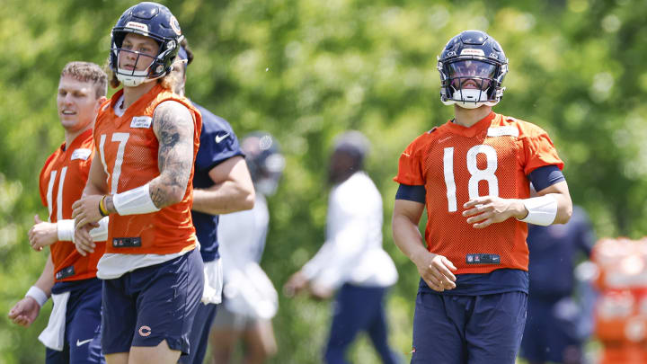 Caleb Williams warms up with other Bears QBs during minicamp. The Bears find Williams' work ethic runs contrary to rumors.