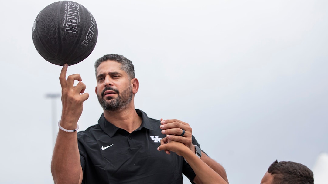 University of Kentucky assistant men's basketball coach Orlando Antigua helped Gage Durrett, 9, spin a basketball on his finger while visiting Pillar's Crestwood Station day program. June 8, 2021
Aj4t3915 University of Kentucky assistant men's basketball coach Orlando Antigua helped Gage Durrett, 9, spin a basketball on his finger while visiting Pillar's Crestwood Station day program. June 8, 2021
Aj4t3915