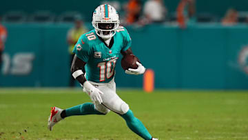 Sep 30, 2024; Miami Gardens, Florida, USA; Miami Dolphins wide receiver Tyreek Hill (10) runs with the ball during the first half against the Tennessee Titans at Hard Rock Stadium. Mandatory Credit: Jasen Vinlove-Imagn Images