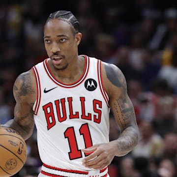 Dec 20, 2023; Chicago, Illinois, USA; Chicago Bulls forward DeMar DeRozan (11) brings the ball up court against the Los Angeles Lakers during the first half at United Center. Mandatory Credit: Kamil Krzaczynski-Imagn Images