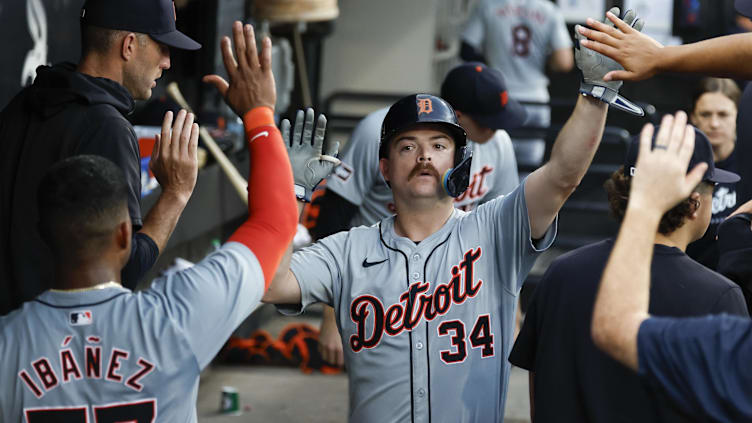 Aug 24, 2024; Chicago, Illinois, USA; Detroit Tigers catcher Jake Rogers (34) celebrates with teammates after scoring against the Chicago White Sox during the third inning at Guaranteed Rate Field. Mandatory Credit: Kamil Krzaczynski-USA TODAY Sports