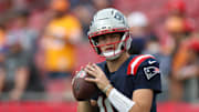 Nov 9, 2025; Tampa, Florida, USA; New England Patriots quarterback Drake Maye (10) warms up before a game against the Tampa Bay Buccaneers at Raymond James Stadium. 