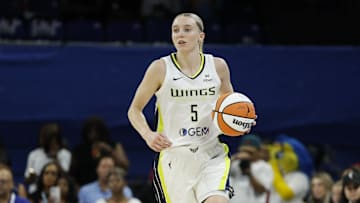 Jul 9, 2025; Chicago, Illinois, USA; Dallas Wings guard Paige Bueckers (5) brings the ball up court against the Chicago Sky during the first half at Wintrust Arena. Mandatory Credit: Kamil Krzaczynski-Imagn Images