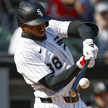 May 24, 2025; Chicago, Illinois, USA; Chicago White Sox center fielder Luis Robert Jr. (88) doubles against the Texas Rangers during the fourth inning at Rate Field. Mandatory Credit: Kamil Krzaczynski-Imagn Images