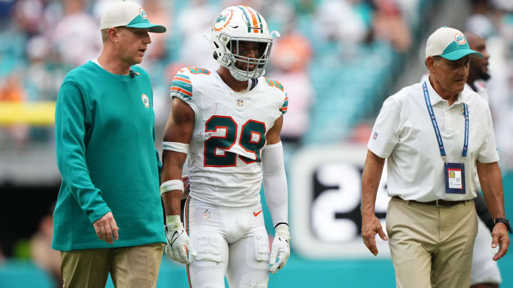 Oct 29, 2023; Miami Gardens, Florida, USA; Miami Dolphins safety Brandon Jones (29) leaves the game with a trainer after an apparent injury during the second half against the New England Patriots at Hard Rock Stadium. 