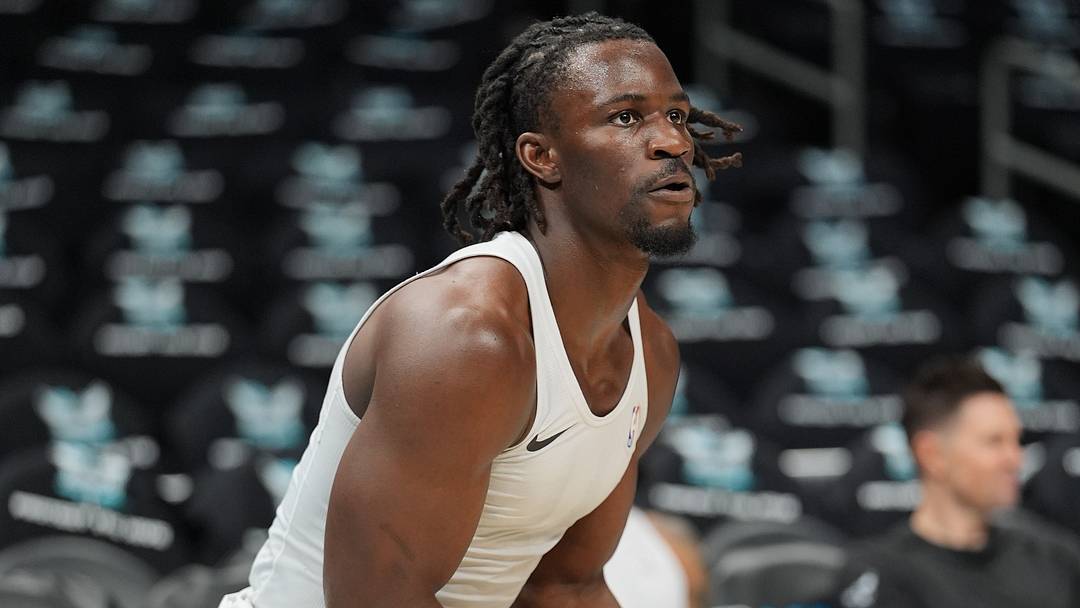 Apr 14, 2026; Charlotte, North Carolina, USA; Charlotte Hornets guard Sion James (4) at pregame warm ups against the Miami Heat during the play-in rounds of the 2026 NBA Playoffs at Spectrum Center. Mandatory Credit: Jim Dedmon-Imagn Images